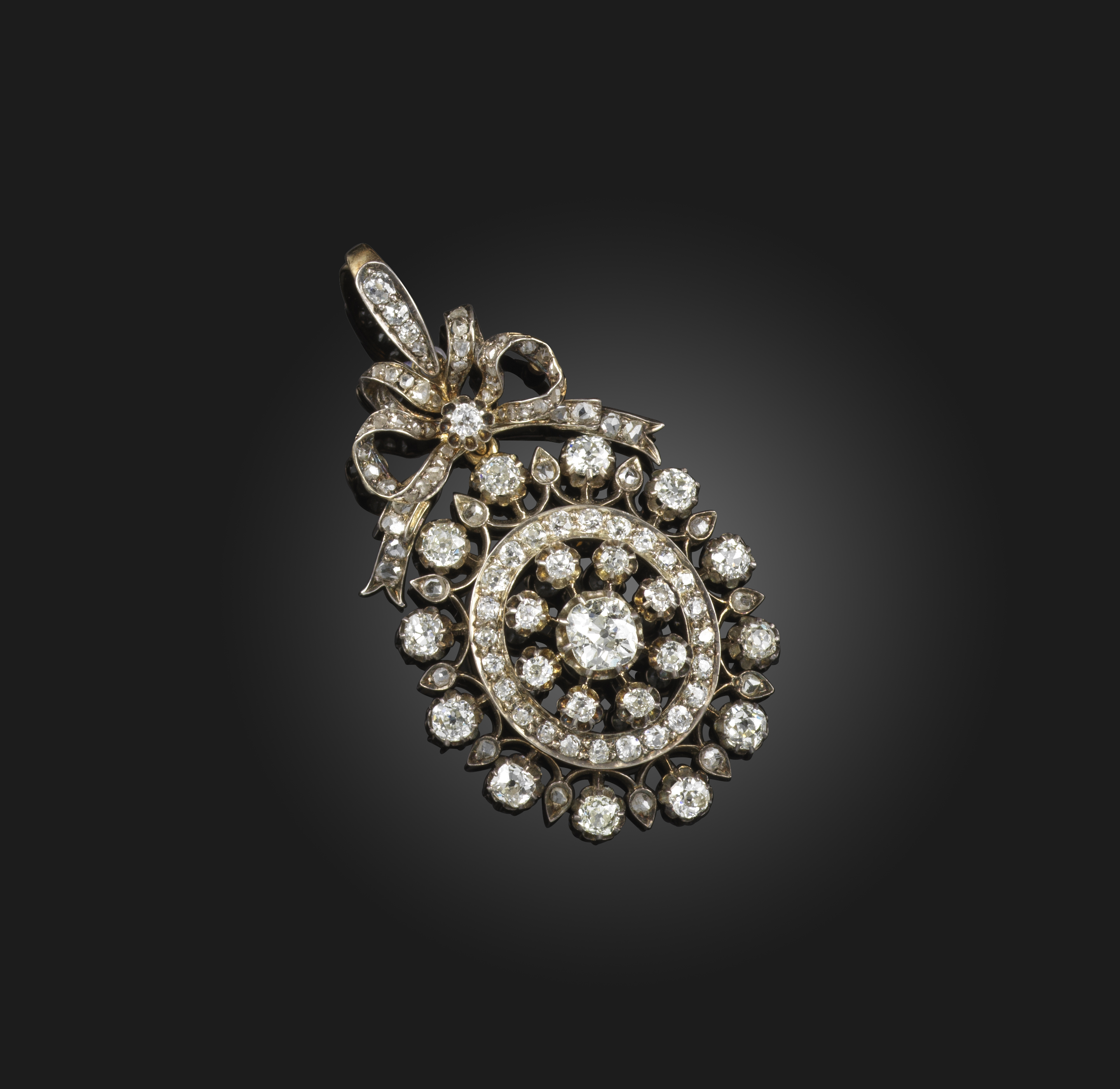 A Victorian diamond-set pendant, late 19th century, set with a central old cushion-shaped diamond