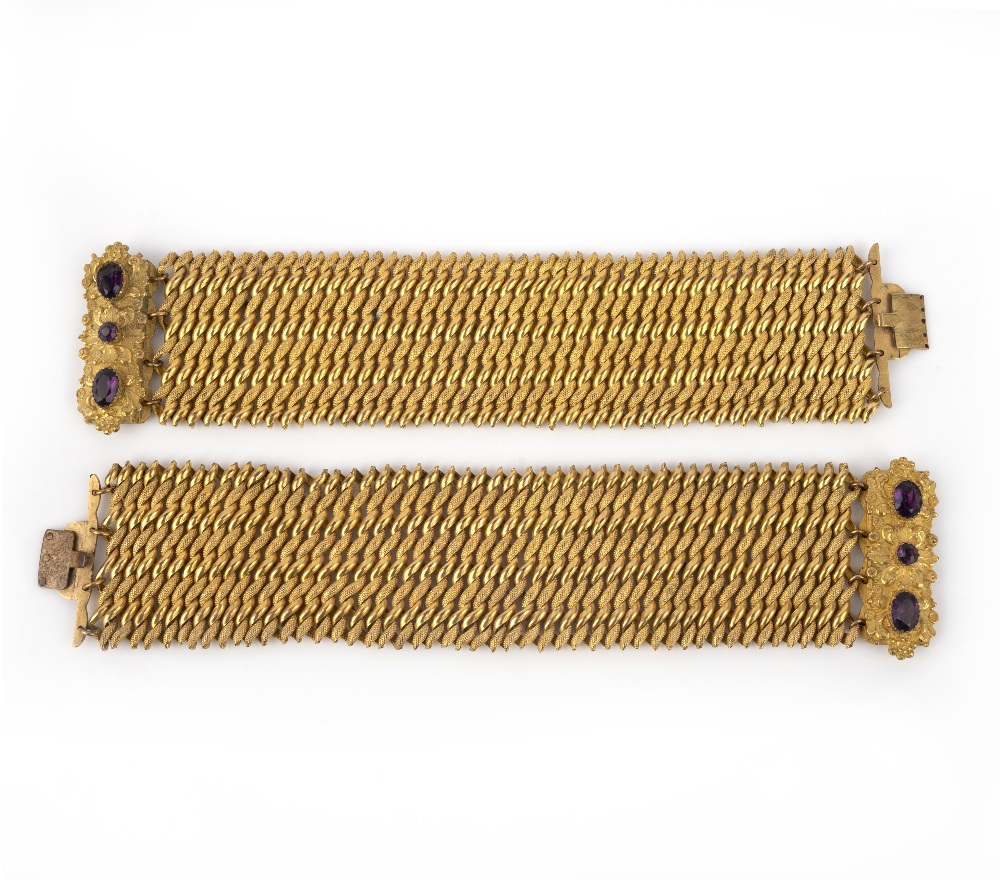 A pair of gilt metal and paste bracelets, mid 19th century, each composed of spiral linking, to a