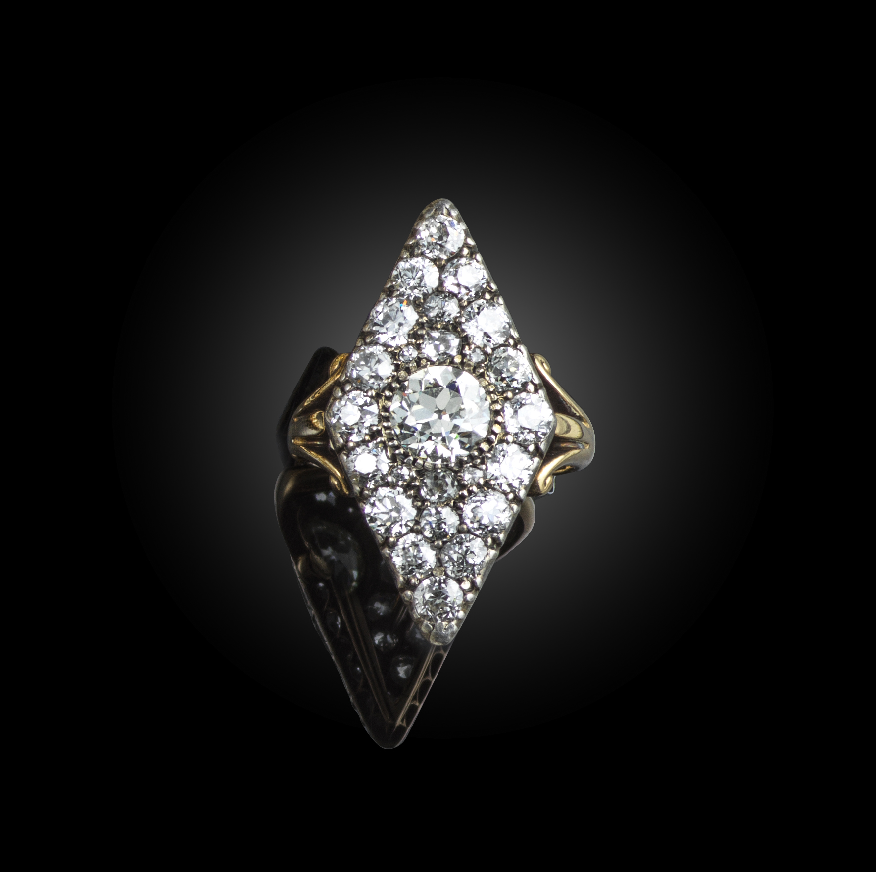 A Victorian diamond ring, late 19th century, of lozenge-shaped outline, set with circular-cut and