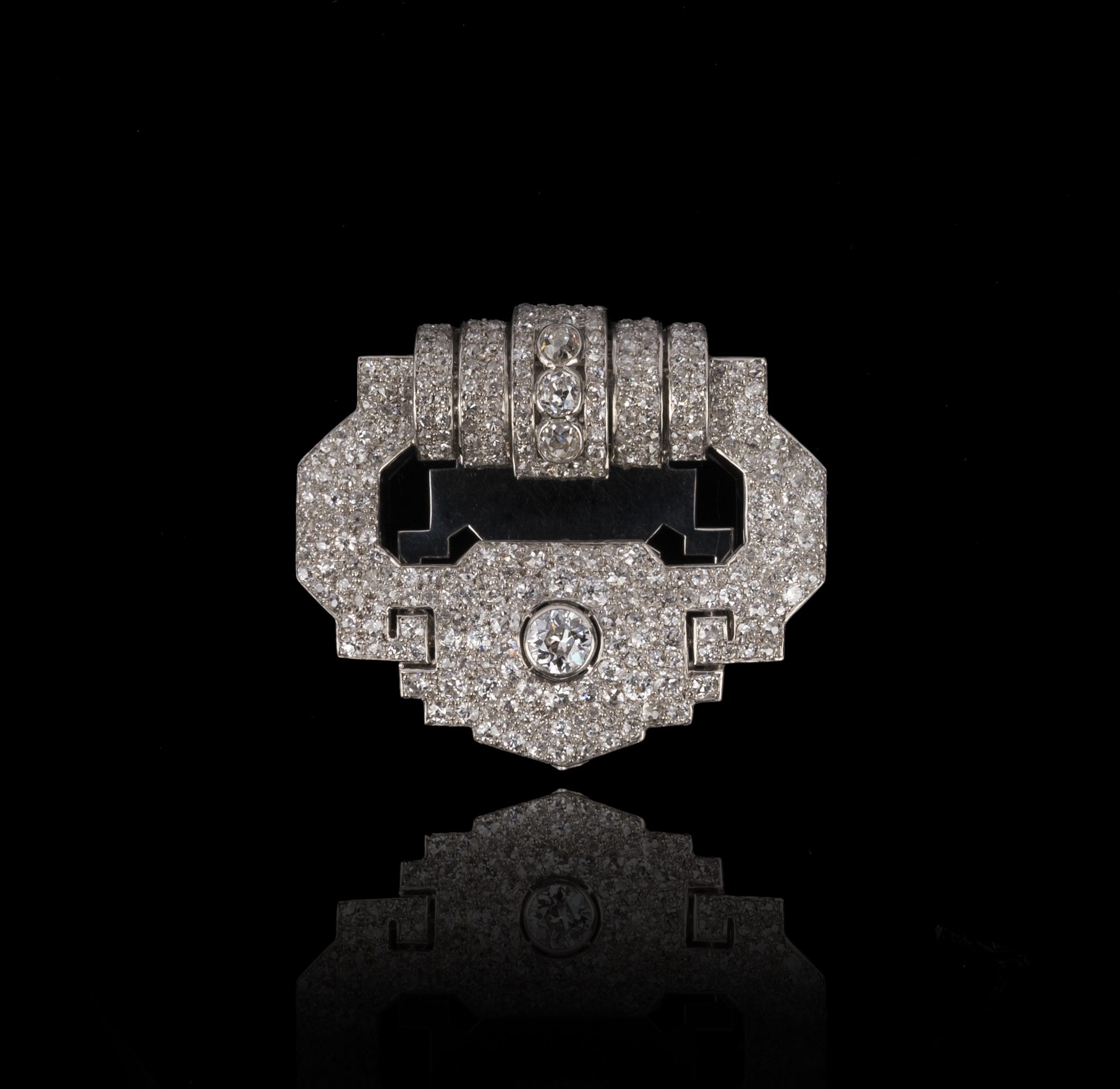 Cartier, an Art Deco diamond clip brooch, circa 1930, designed as a stylised buckle, the top - Image 2 of 2
