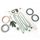 λ A collection of jewellery including a jadeite bangle, comprising: a white and russet jadeite