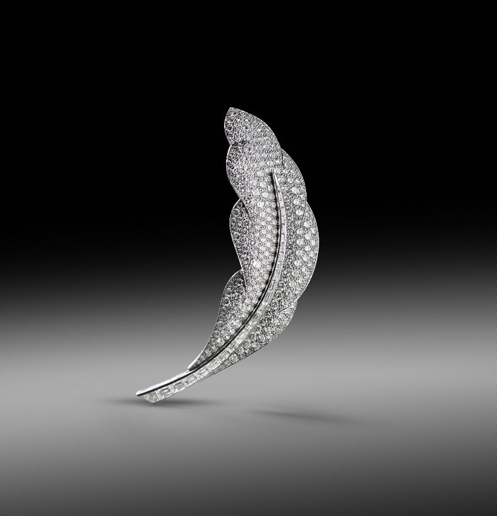 Van Cleef & Arpels, a diamond-set feather brooch 1990s, with a central line of graduated tapered