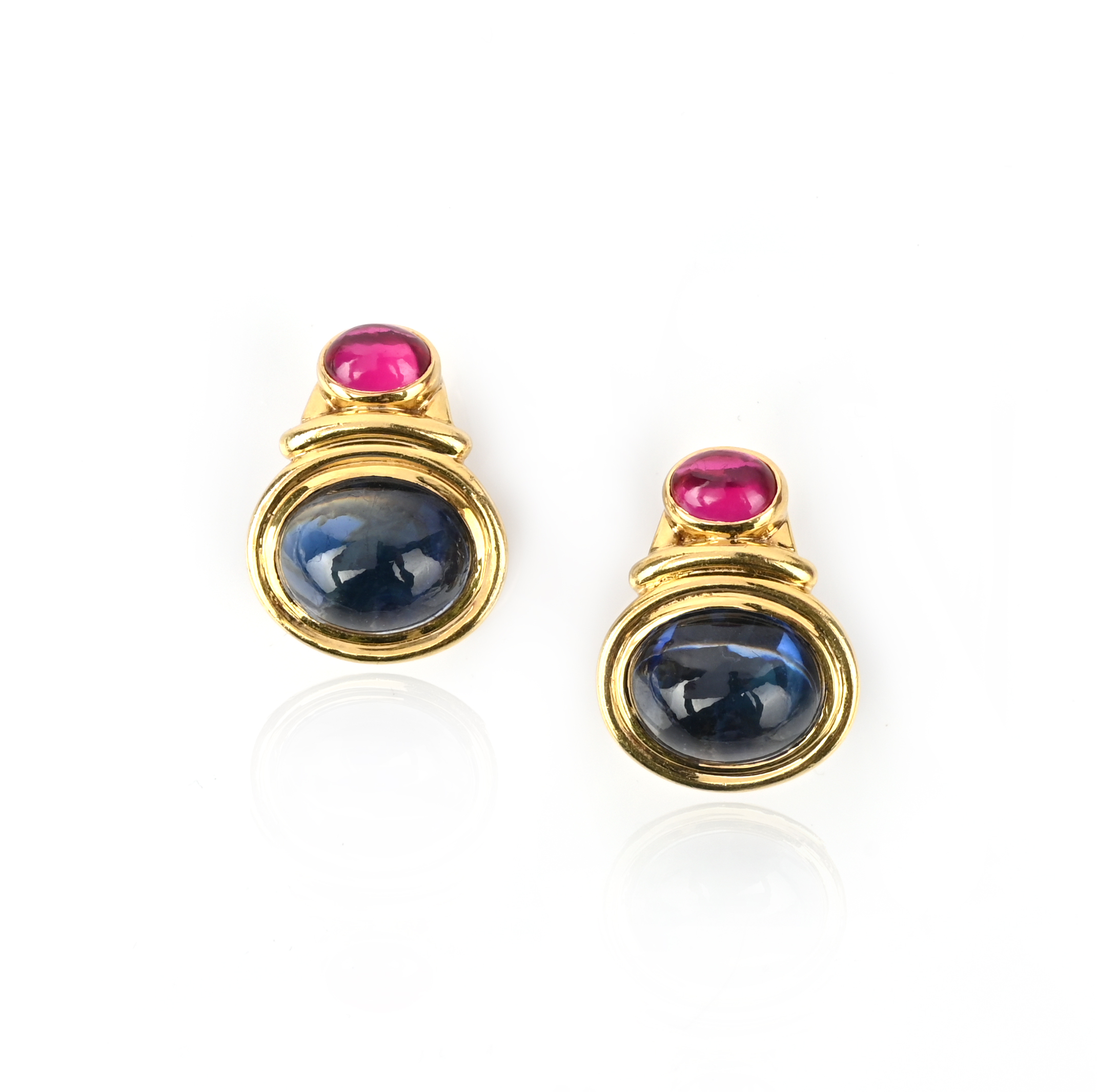 A pair of synthetic gem-set gold earrings, set with a cabochon blue and red stone in polished yellow