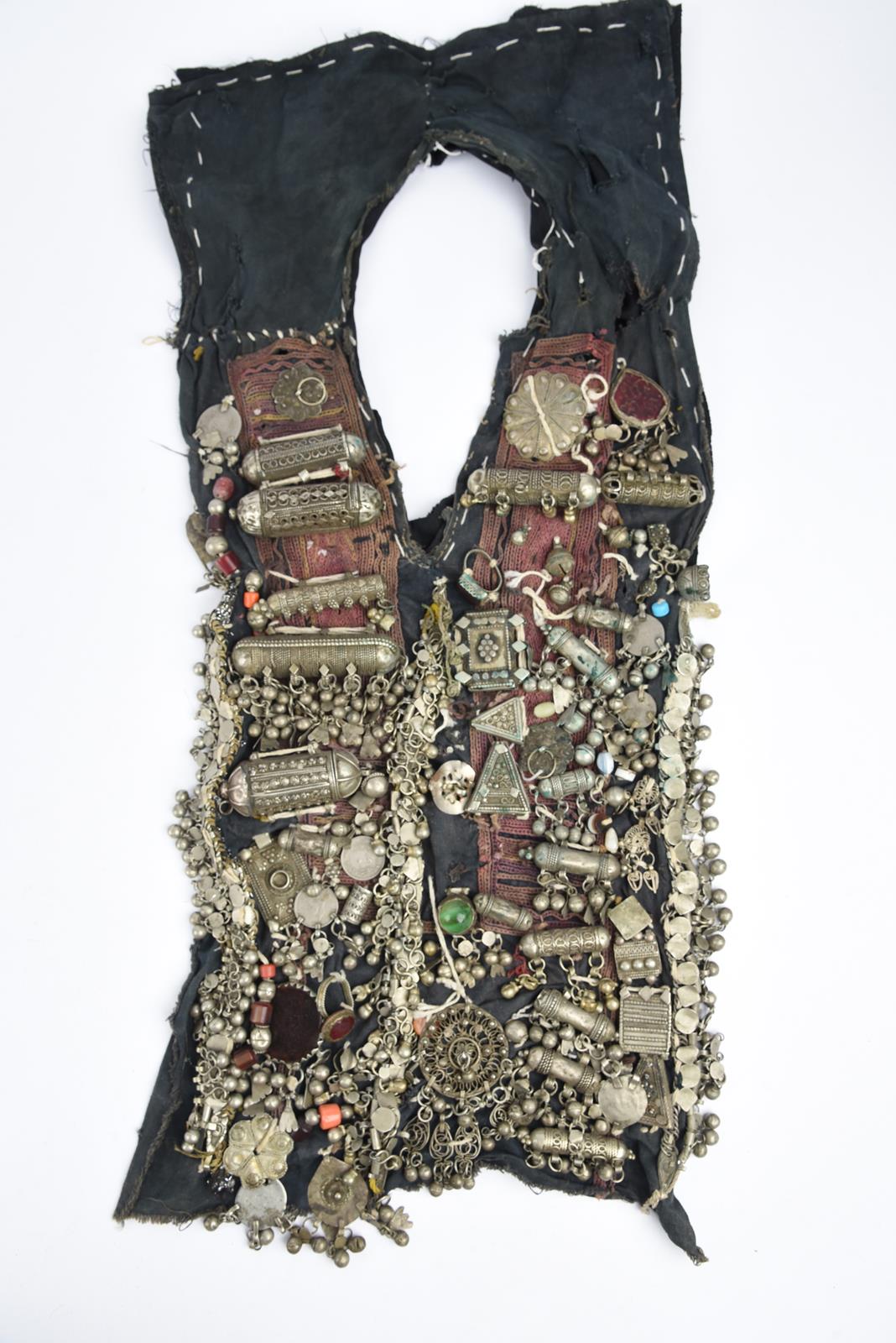λA Bedouin amulet chest ornament cloth with numerous sewn on amulets and beads, 62cm long, and three - Image 22 of 27
