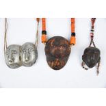 Three Naga 'head' pendant necklaces Nagaland coloured glass beads with an aluminium double head, 5.