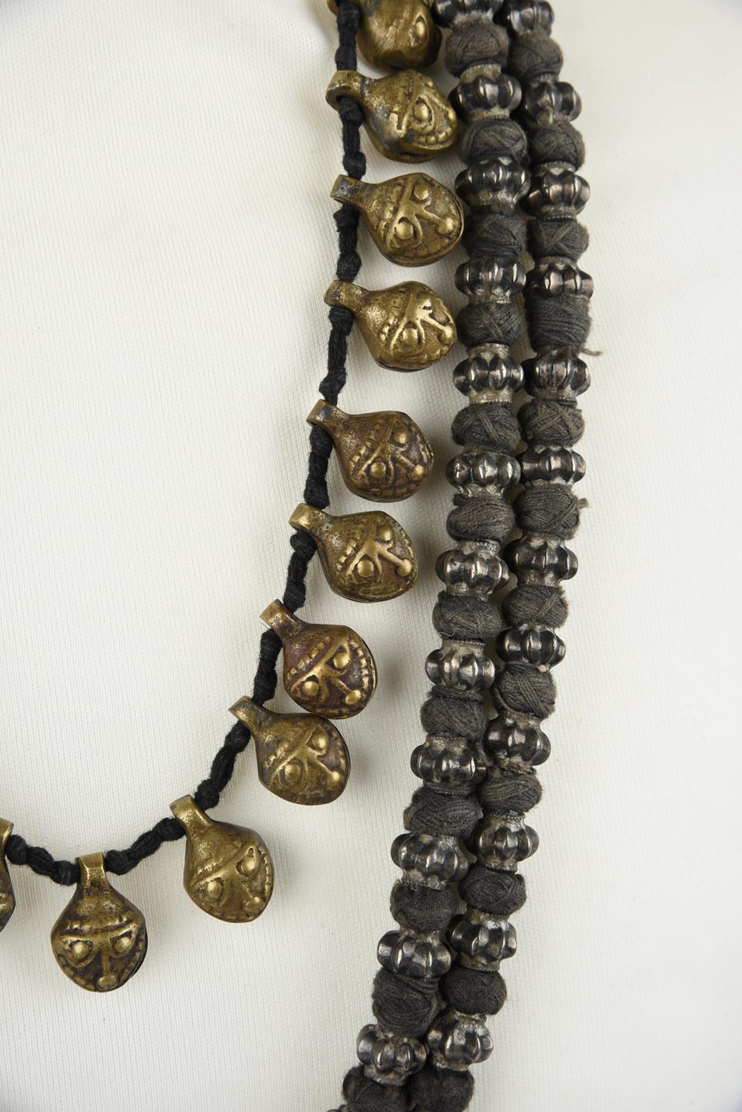Five Nepal metal mounted necklaces including one with an amulet box and a double strand with cog - Image 5 of 17