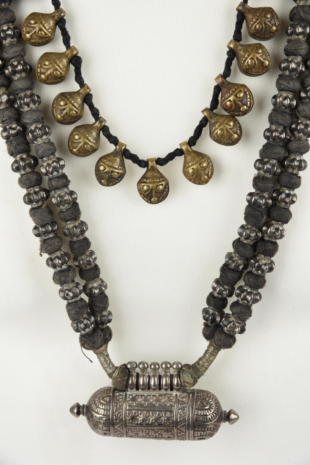 Five Nepal metal mounted necklaces including one with an amulet box and a double strand with cog - Image 4 of 17