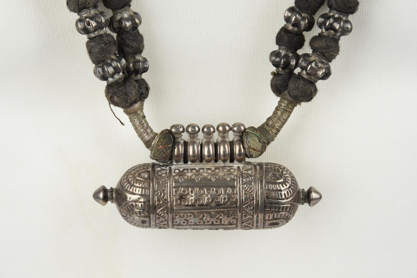 Five Nepal metal mounted necklaces including one with an amulet box and a double strand with cog - Image 7 of 17