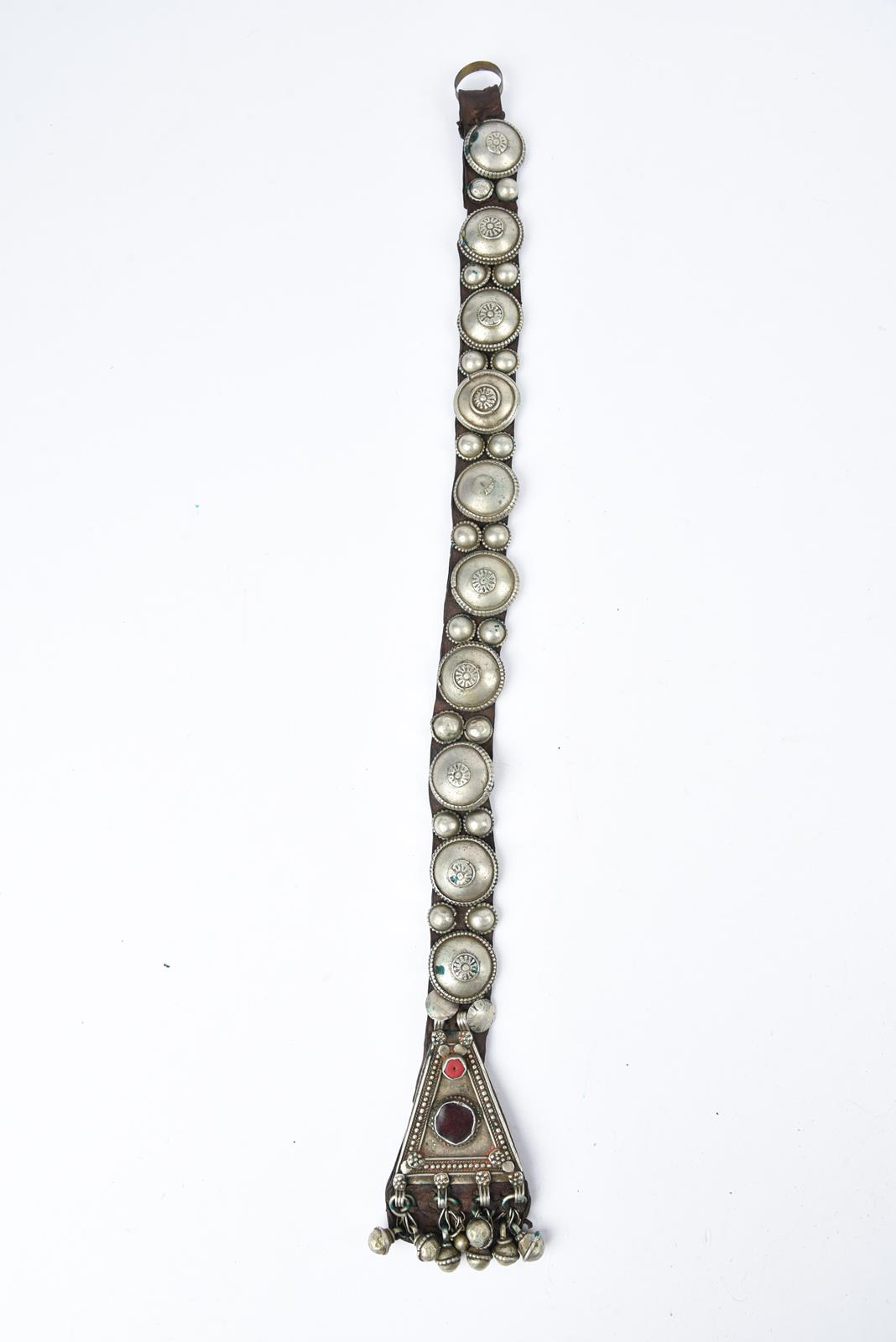 λA Bedouin amulet chest ornament cloth with numerous sewn on amulets and beads, 62cm long, and three - Image 10 of 27