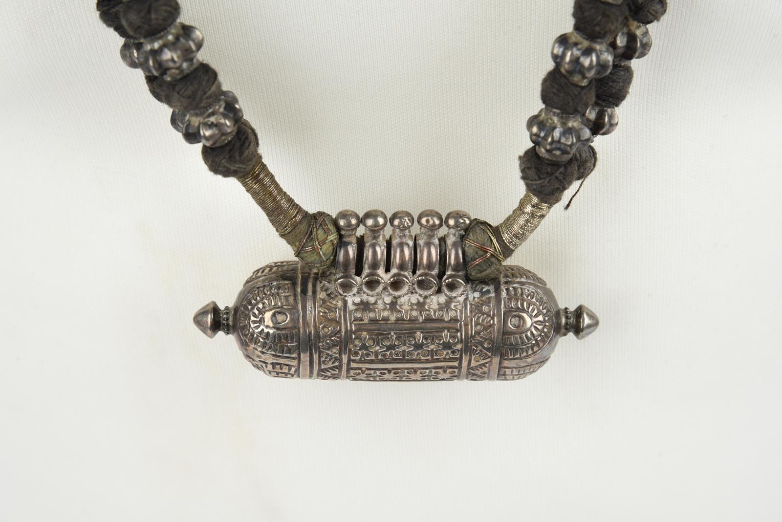 Five Nepal metal mounted necklaces including one with an amulet box and a double strand with cog - Image 8 of 17