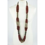 An Andhra Pradesh necklace Southeast India red and white glass beads with twelve brass hexagonal