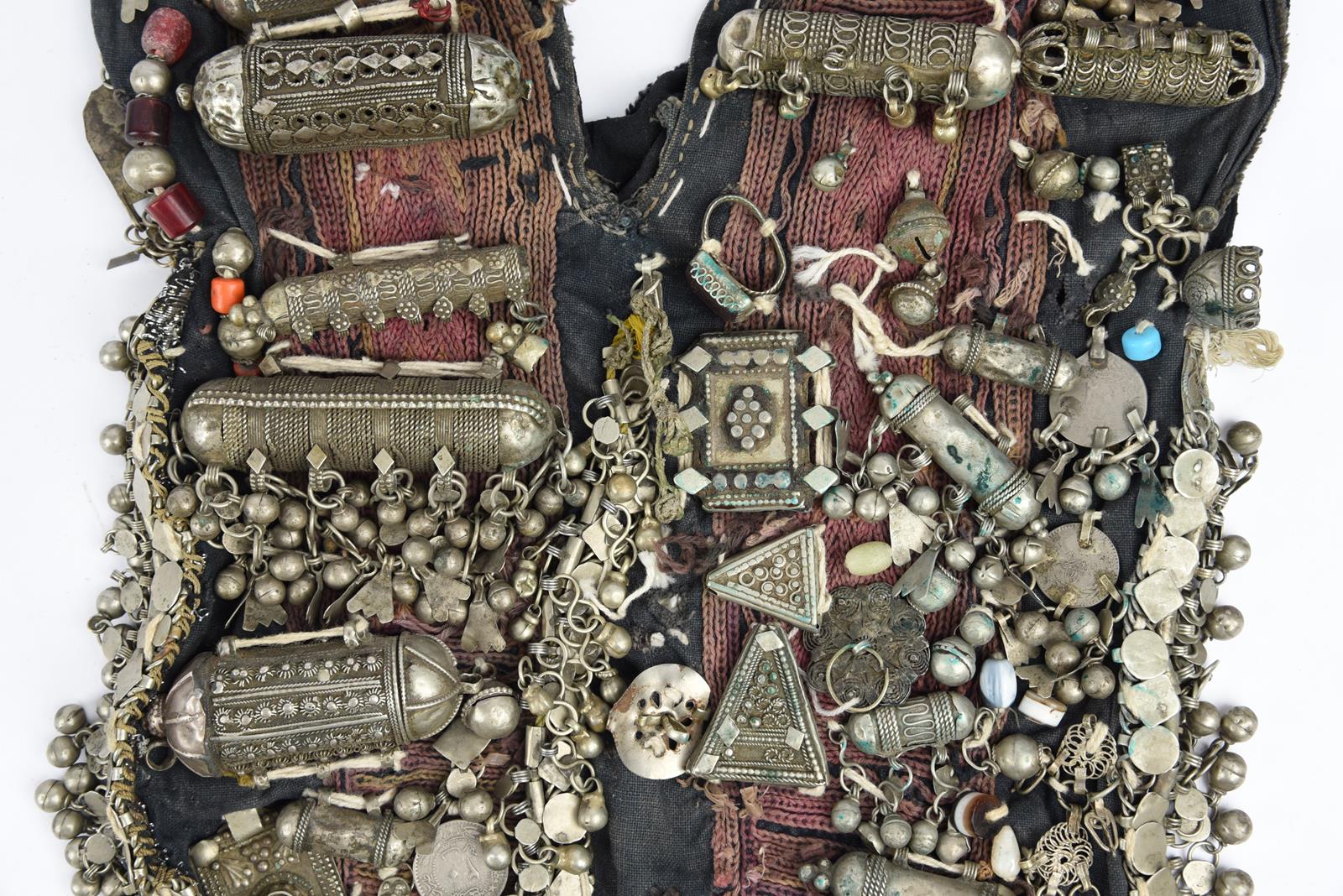 λA Bedouin amulet chest ornament cloth with numerous sewn on amulets and beads, 62cm long, and three - Bild 24 aus 27