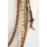 Three Tibetan mala beads including one with wood, stone and shell beads with two strands of iron
