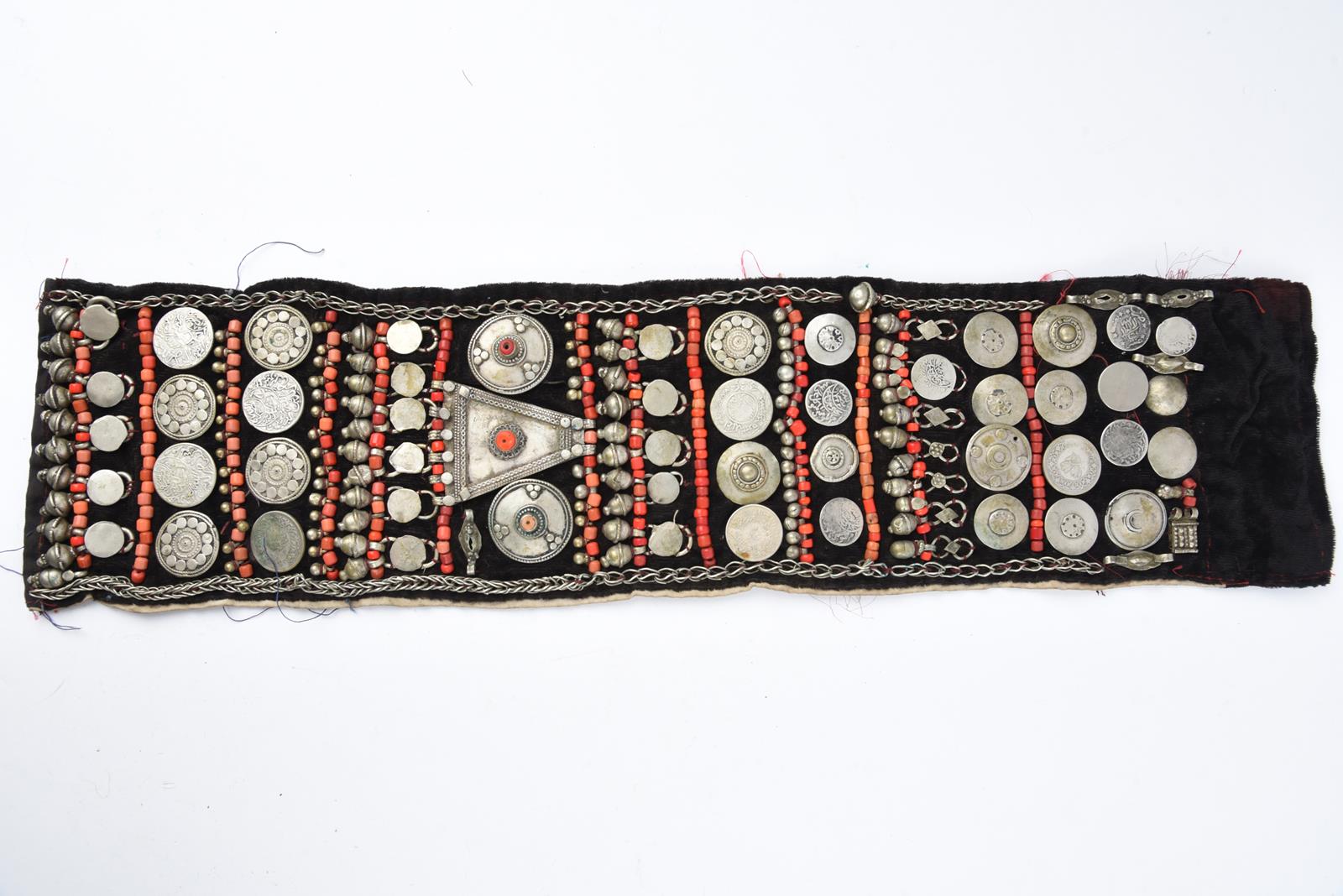 λA Bedouin amulet chest ornament cloth with numerous sewn on amulets and beads, 62cm long, and three - Image 16 of 27