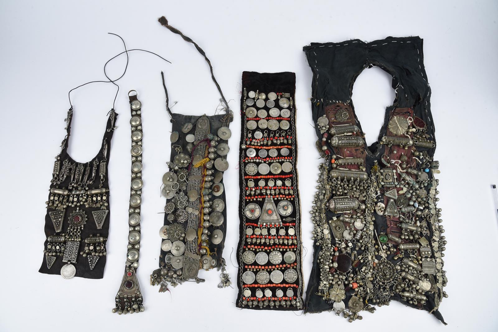 λA Bedouin amulet chest ornament cloth with numerous sewn on amulets and beads, 62cm long, and three - Image 2 of 27