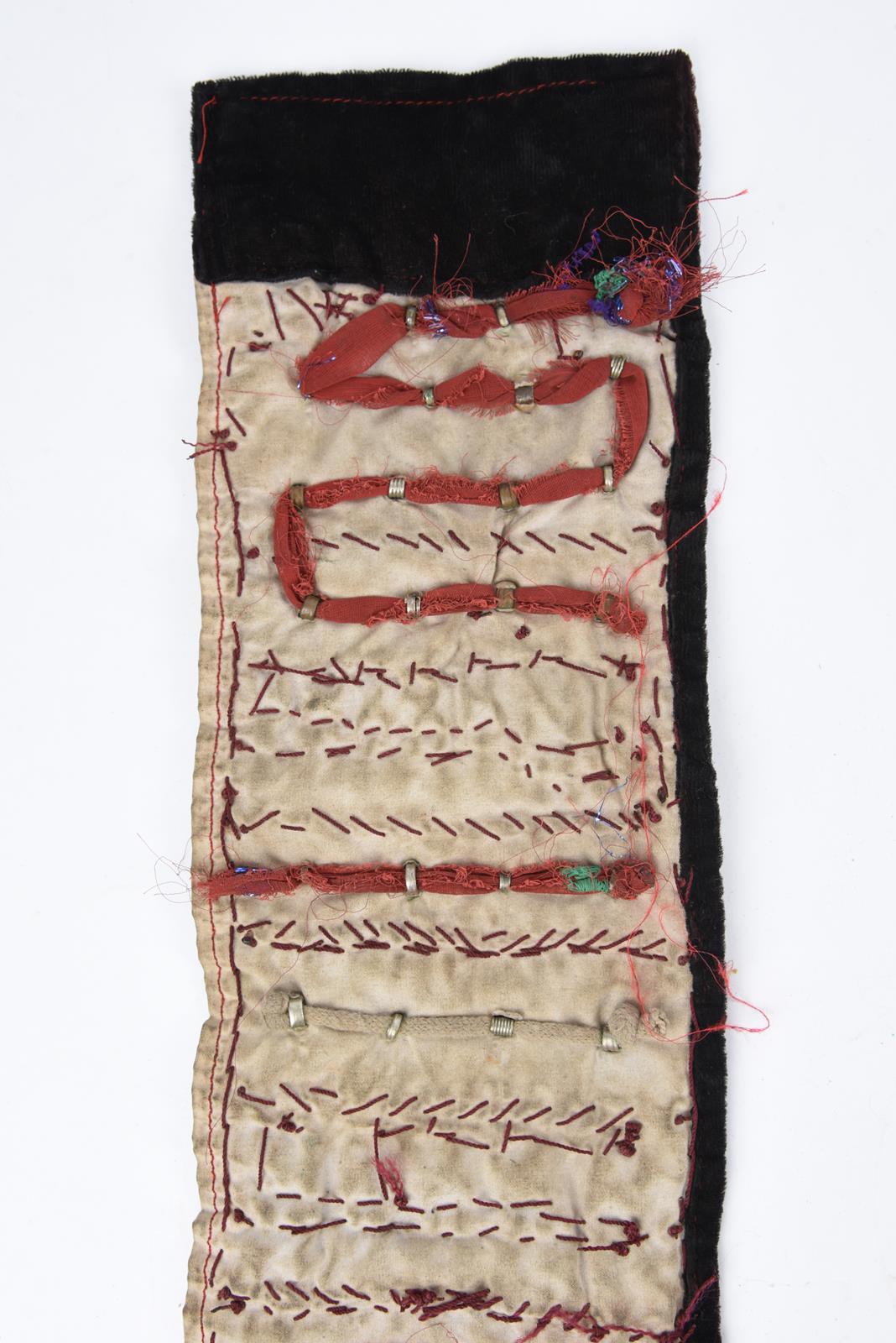 λA Bedouin amulet chest ornament cloth with numerous sewn on amulets and beads, 62cm long, and three - Image 21 of 27