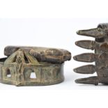 A Lobi bronze armband Burkina Faso cast with crocodiles and with incised bands, 14cm long, and two