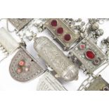 λEight Bedouin hirz receptacles silver coloured metal and brass, four with glass mounted beads,