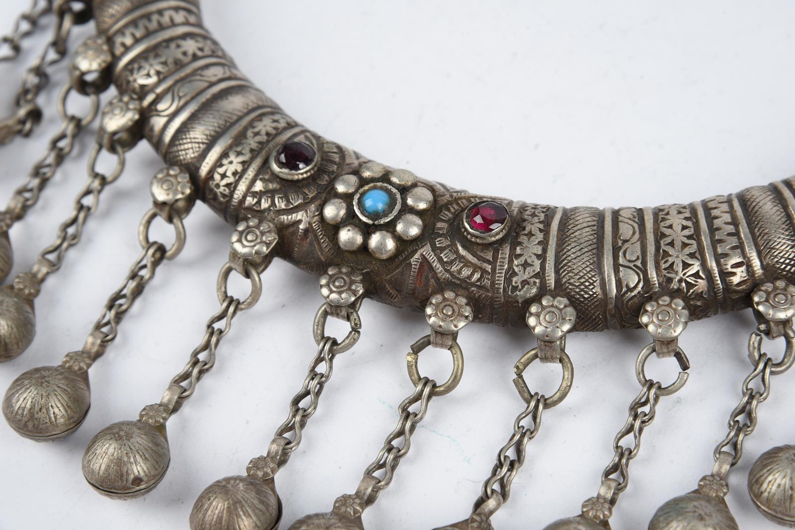 Three Nuristan torques silver coloured metal with applied blue stone and red and blue glass beads, - Image 6 of 19