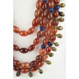 A Naga woman's necklace Nagaland carnelian beads, blue glass beads, brass bells, brass spacers,