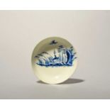 A Longton Hall or West Pans blue and white saucer, c.1760-65, painted with a Chinese landscape