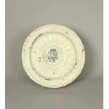 A massive Bianco di Faenza maiolica charger, 17th century, decorated a compendario with the arms