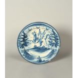A large maiolica dish or charger, 18th century, possibly Savona, painted in blue with three birds in