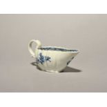 A Bristol blue and white creamboat or small sauceboat, c.1772, of fluted form, painted with sprays