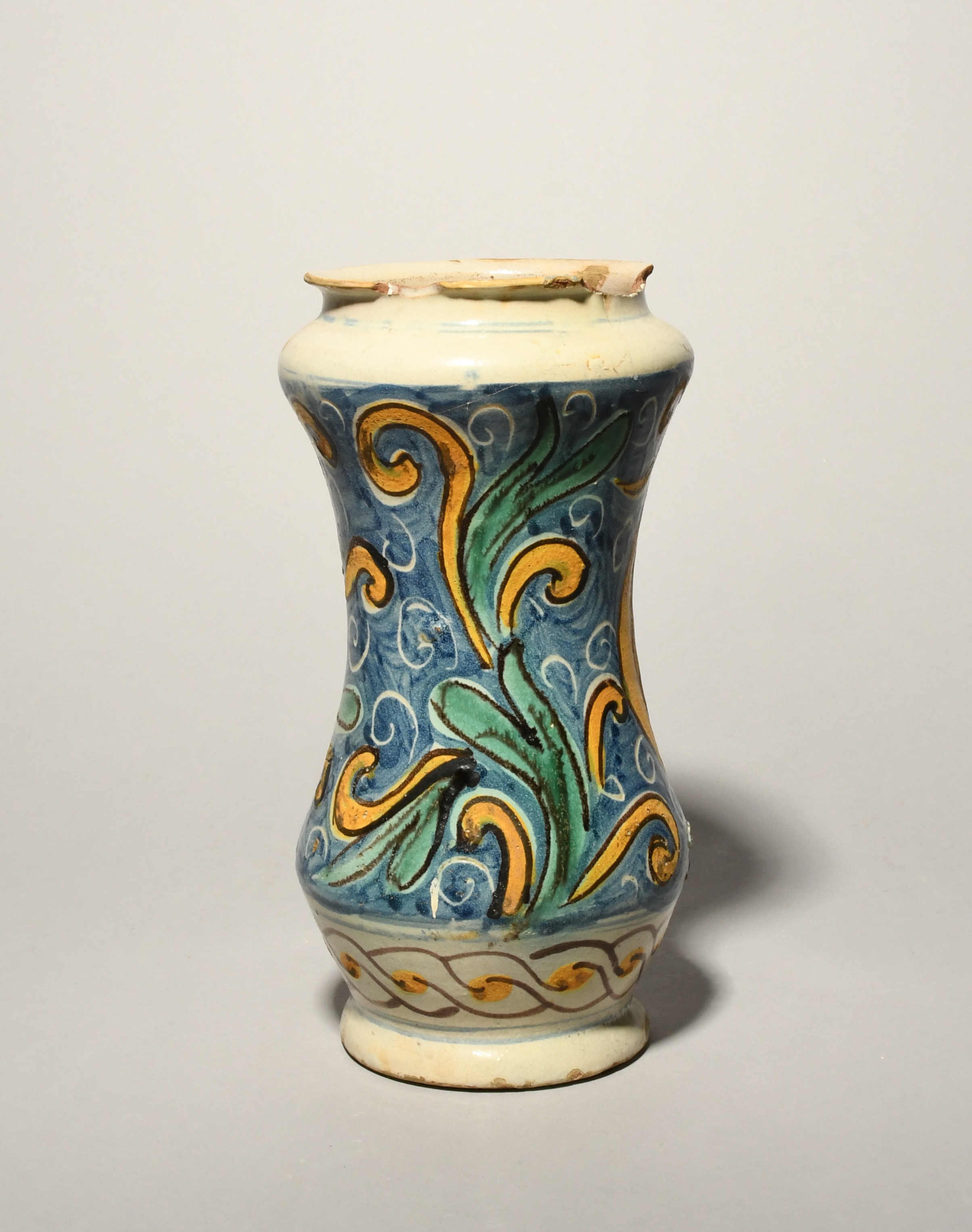 A Sicilian maiolica albarello, late 17th century, the waisted form painted in blue, green, yellow - Image 2 of 3