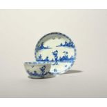 A Vauxhall blue and white teabowl and saucer, c.1755, painted in a strong blue with a Chinese figure