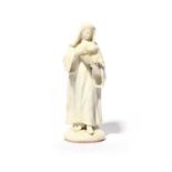 A Bow white-glazed figure of a nun, c.1755, standing and reading from a prayer book held in her left