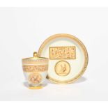 A Vienna cabinet cup and saucer, date code for 1801, decorated with bands and panels of hieroglyphs,