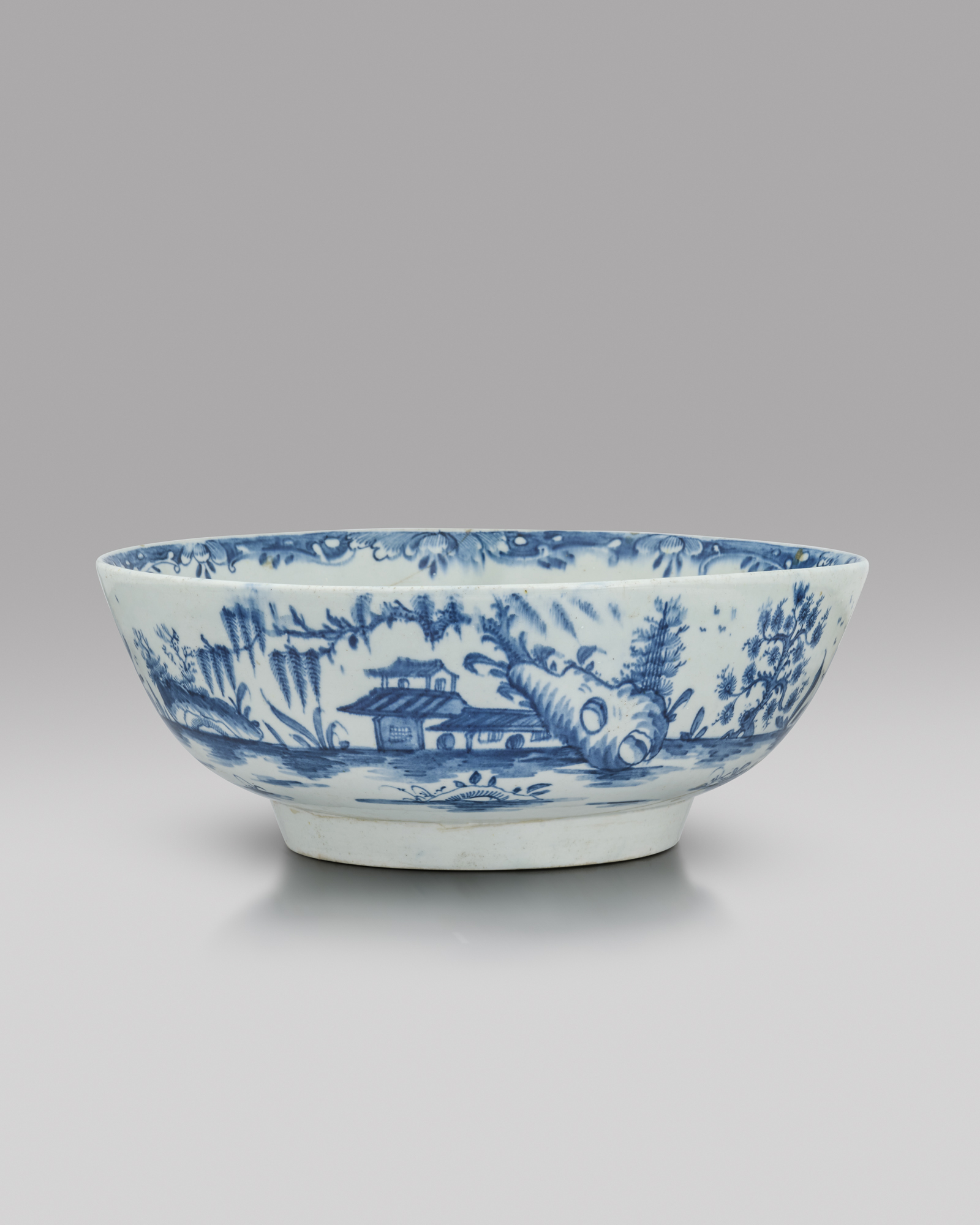 An important and documentary Lowestoft blue and white punchbowl, c.1760-62, the interior painted - Image 2 of 2