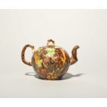 A large Whieldon-type teapot and cover, c.1750-60, the globular body applied with sprays of fruiting