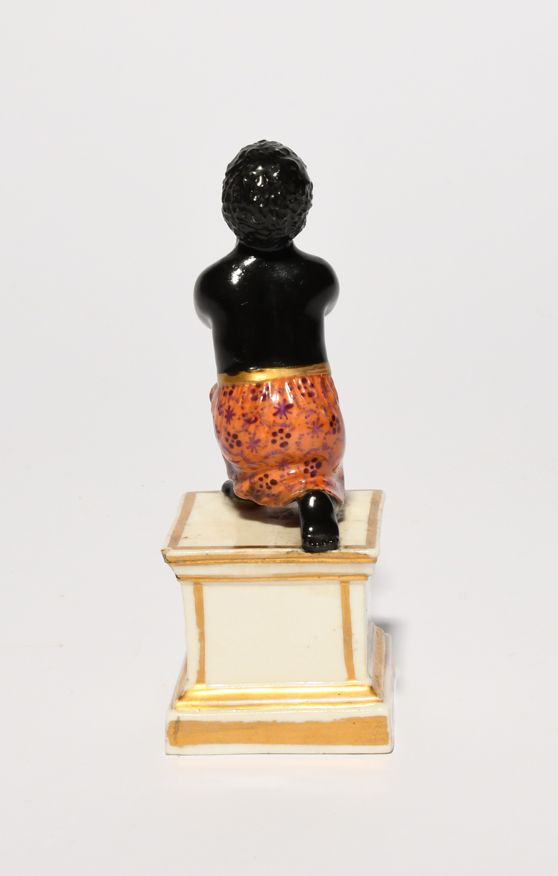 A rare Derby anti-slavery figure, early 19th century, modelled as a young black slave on one knee - Image 3 of 5