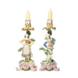 A rare matched pair of Bow candlestick figures of the Dutch Dancers, c.1765-70, he standing with his