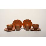 Four Tophane cups and saucers, late 19th century Turkey, the polished red stoneware incised and