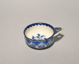 A Bristol delftware bleeding bowl, c.1730, the shallow circular form painted to the exterior with