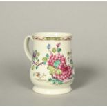 A large and early Bow mug, c.1753-55, the bell-shaped body painted with a spray of pink peony and