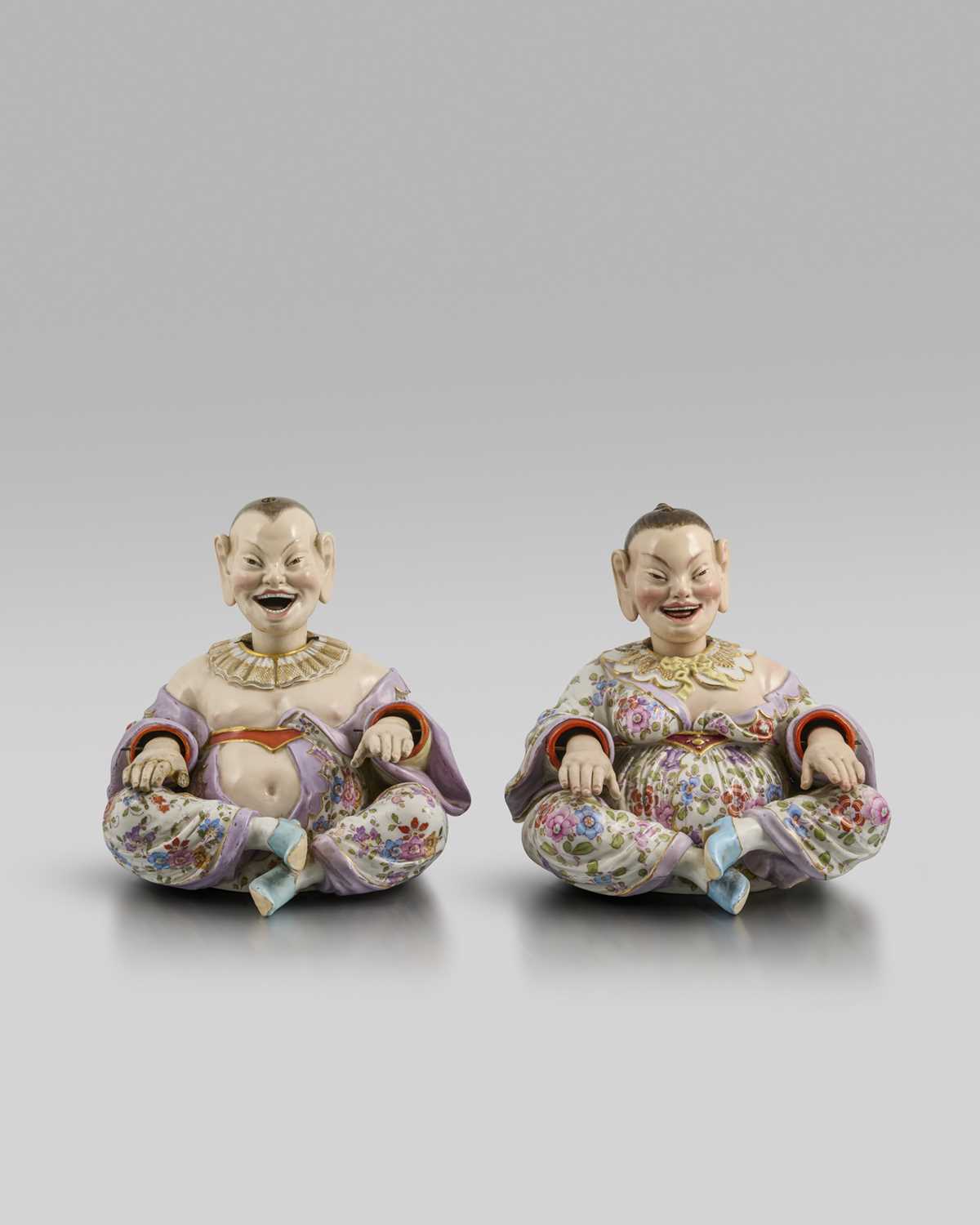 Two Meissen pagoda figures, late 19th/20th century, modelled as a Chinaman and his female companion,