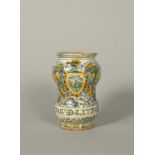 A small Italian maiolica albarello or pill jar, dated 1662, the waisted form painted in blue,