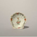 An early Worcester pickle dish, c.1753-54, formed as a scallop shell, painted in polychrome