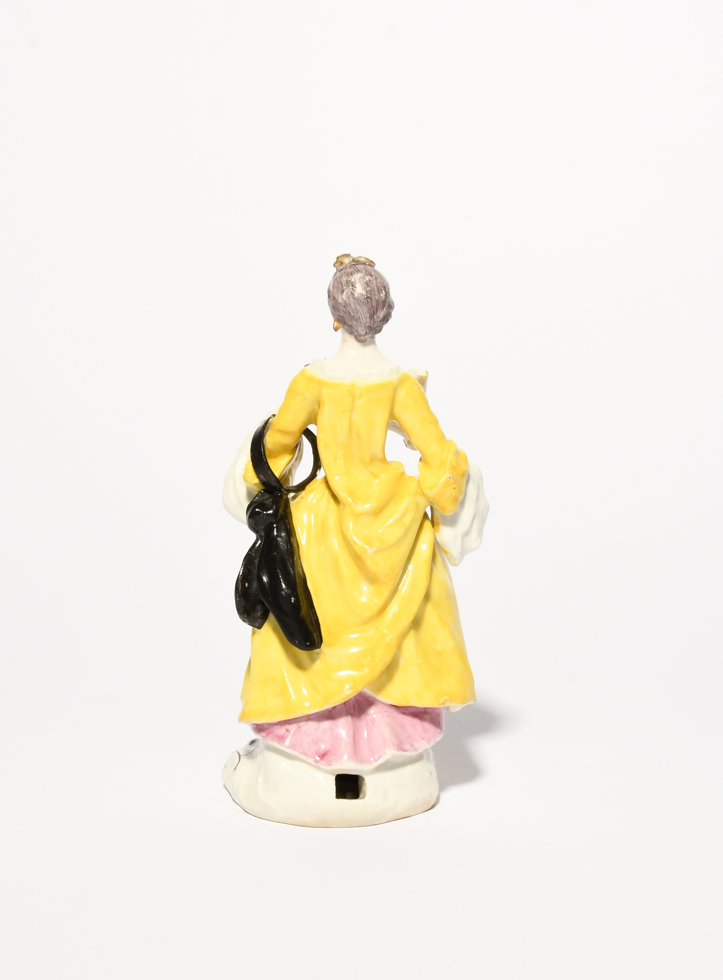 A rare Bow figure of a lady, c.1758, after a Meissen model by Peter Reinicke, wearing a layered - Image 3 of 3