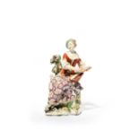 A Chelsea figure of a female musician, c.1760, possibly emblematic of Hearing, seated and playing