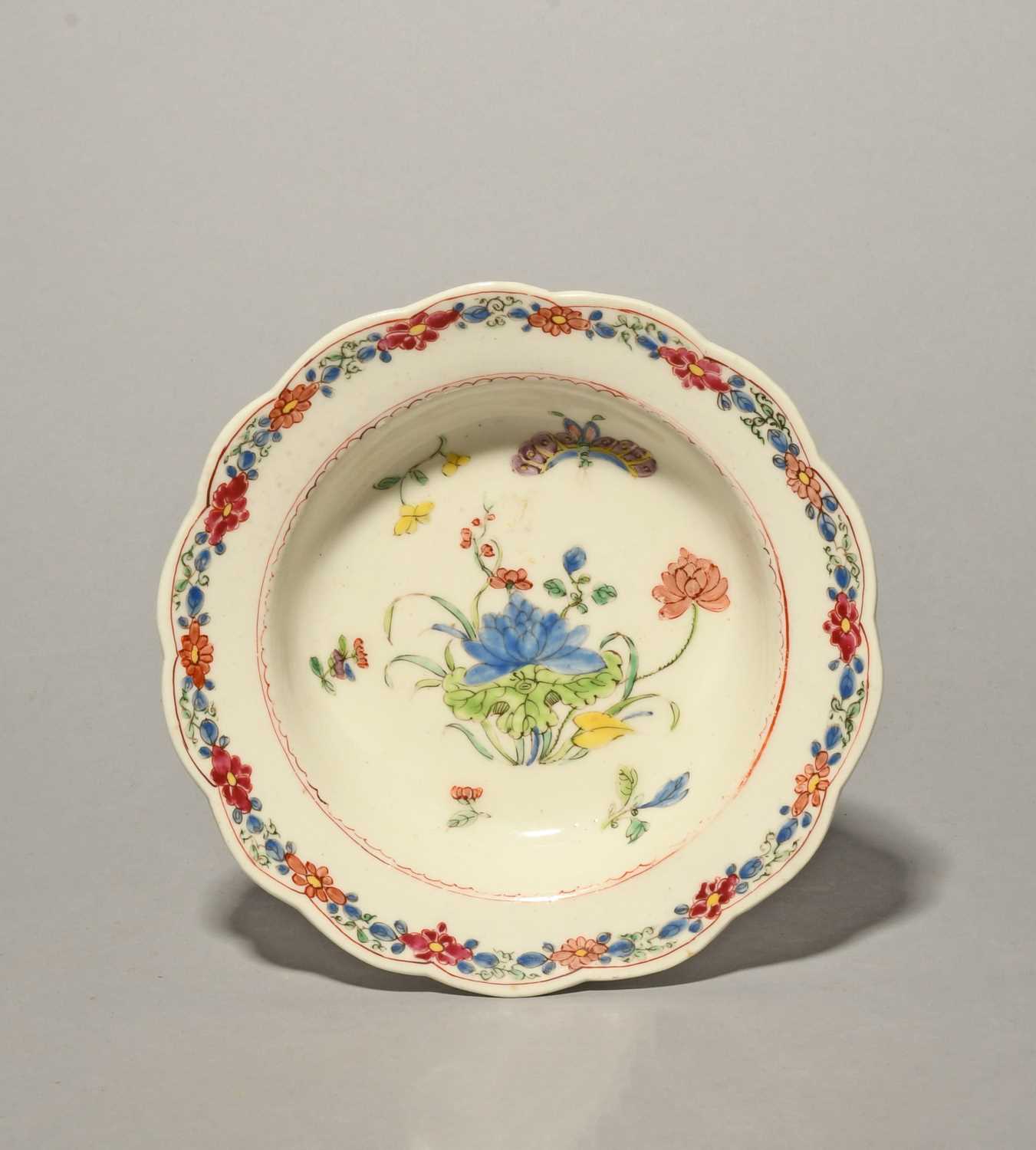 An early Bow pudding basin or small bowl, c.1752, the deep well painted in famille rose enamels with