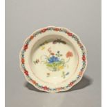 An early Bow pudding basin or small bowl, c.1752, the deep well painted in famille rose enamels with