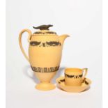 A Wedgwood caneware Egyptian Revival coffee pot and cover, early 19th century, applied in black with