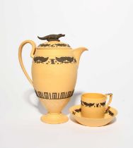 A Wedgwood caneware Egyptian Revival coffee pot and cover, early 19th century, applied in black with