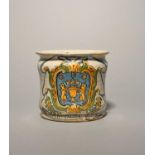 A Naples maiolica albarello, dated 1773, the wide squat form painted with two lions rampant flanking