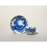 A rare Vauxhall blue and white teabowl and saucer, c.1755, painted with the Dragon pattern after a